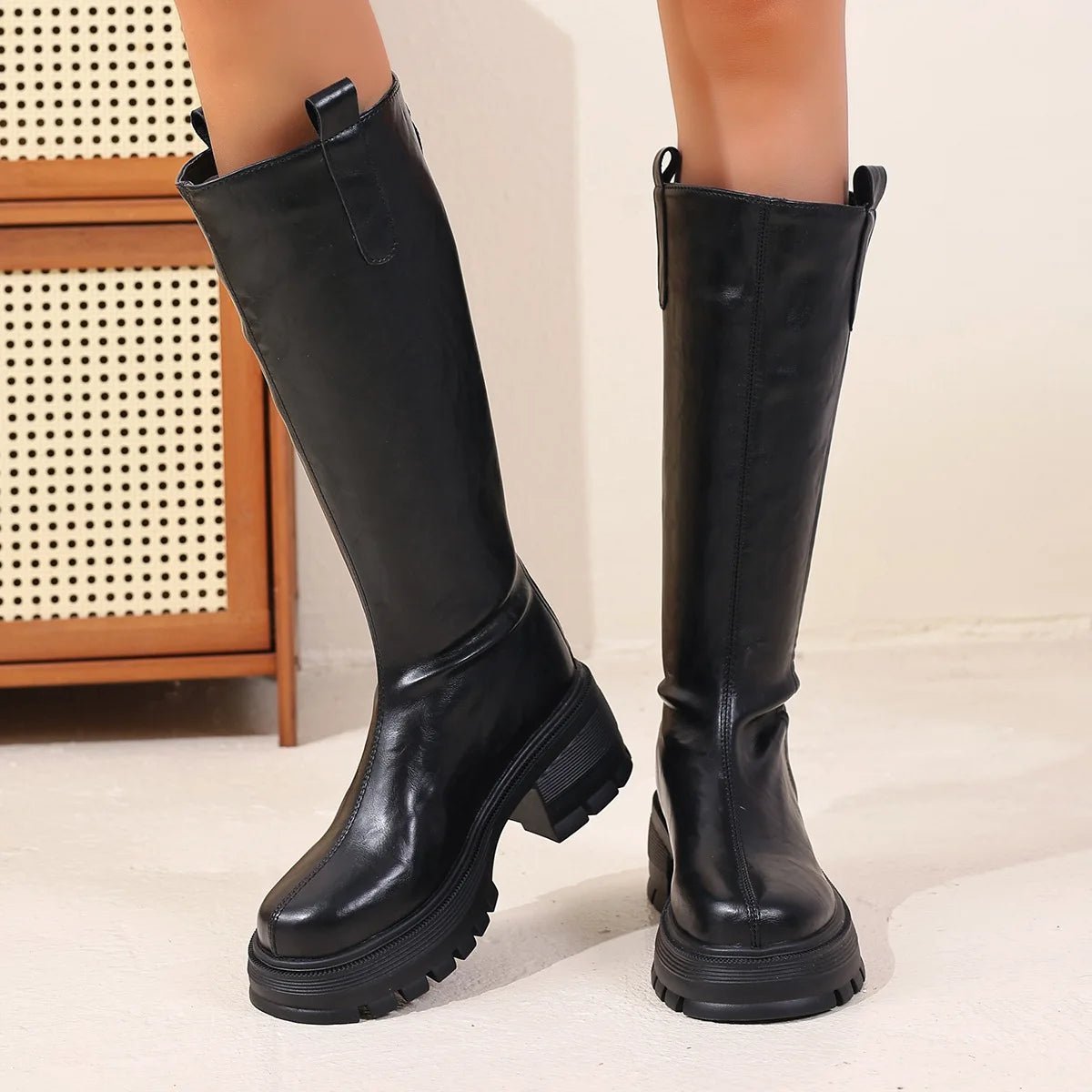 Botas de cano alto em pele Feliz