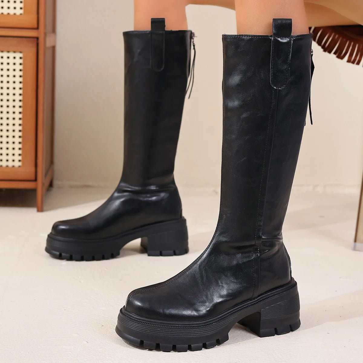 Botas de cano alto em pele Feliz