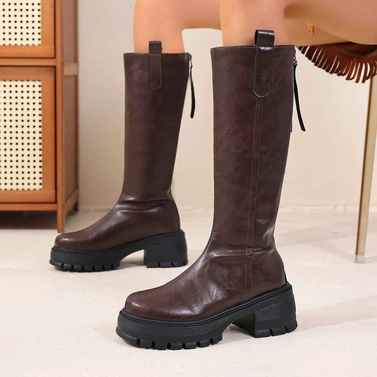 Botas de cano alto em pele Feliz