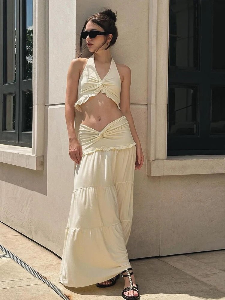 Conjunto de top curto com decote halter e saia plissada Jane