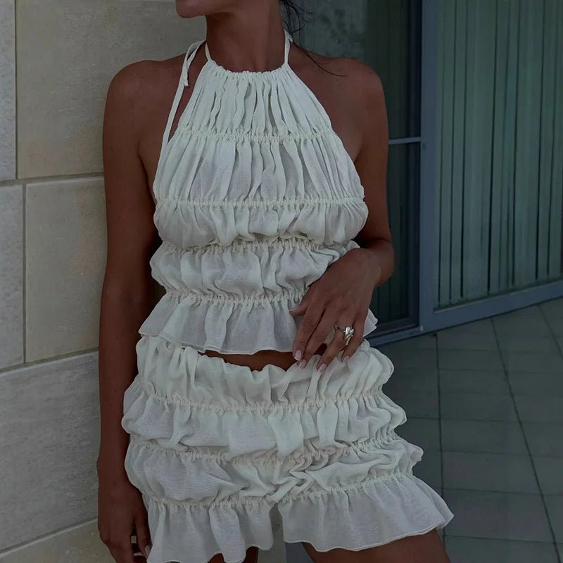 Conjunto Priya de top de alças com laço e saia plissada