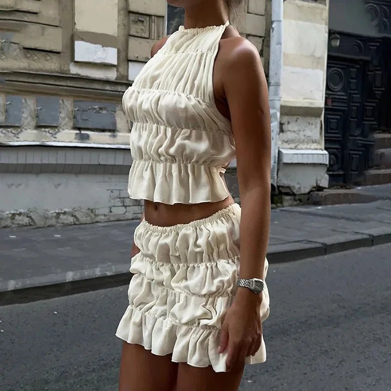 Conjunto Priya de top de alças com laço e saia plissada